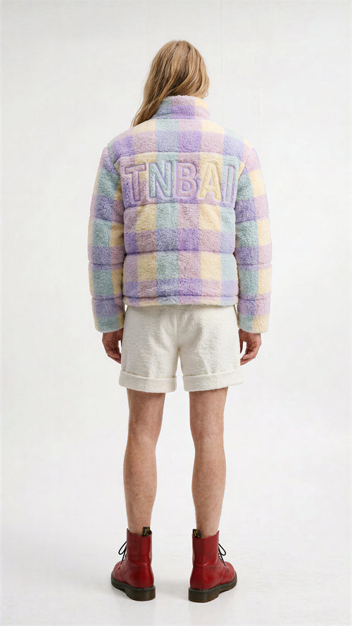 View from the back. On the jacket, make a 'TNBAI' white with outline like baseball embroidery.